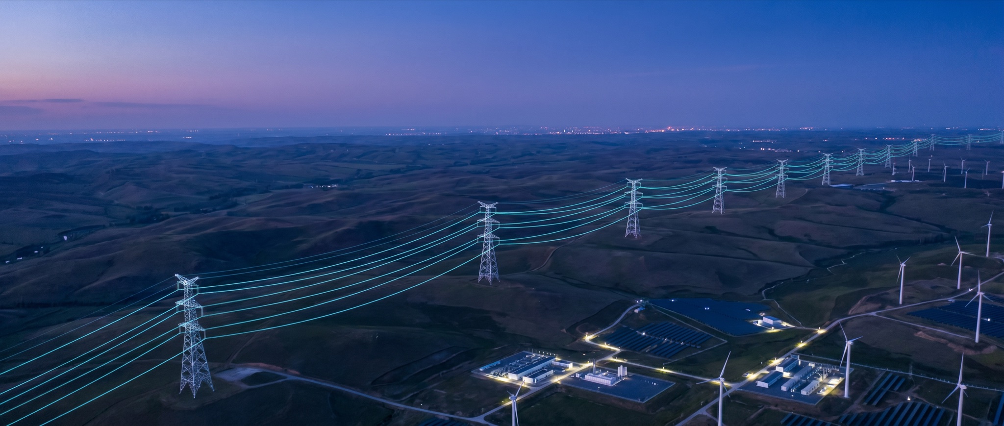 An aerial view of energy infrastructure across the landscape at blue hour
